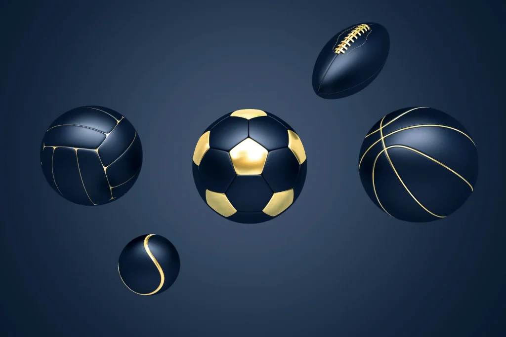 Sportbälle in Gold und Schwarz mit schwarzem Hintergrund